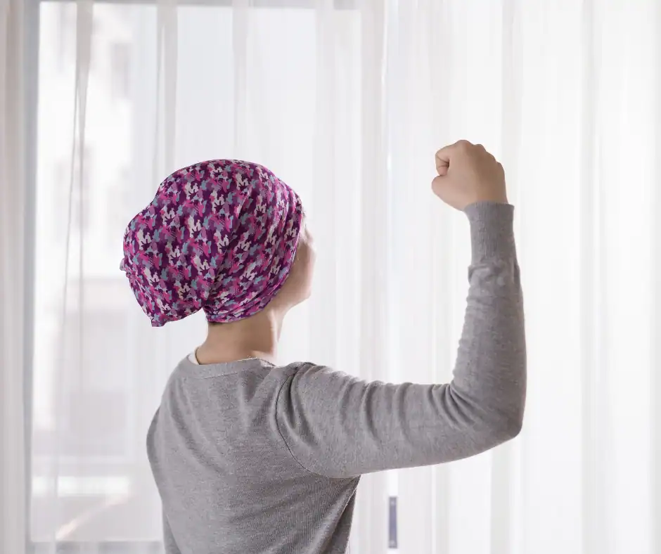 Woman with a colorful wig looking out a window in Minnesota.