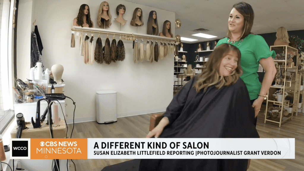 Customer enjoying a wig consultation at Wigs by Opulence in Minnesota.