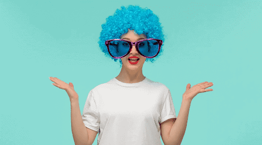 Woman with bright blue curly wig and oversized sunglasses in Minnesota.