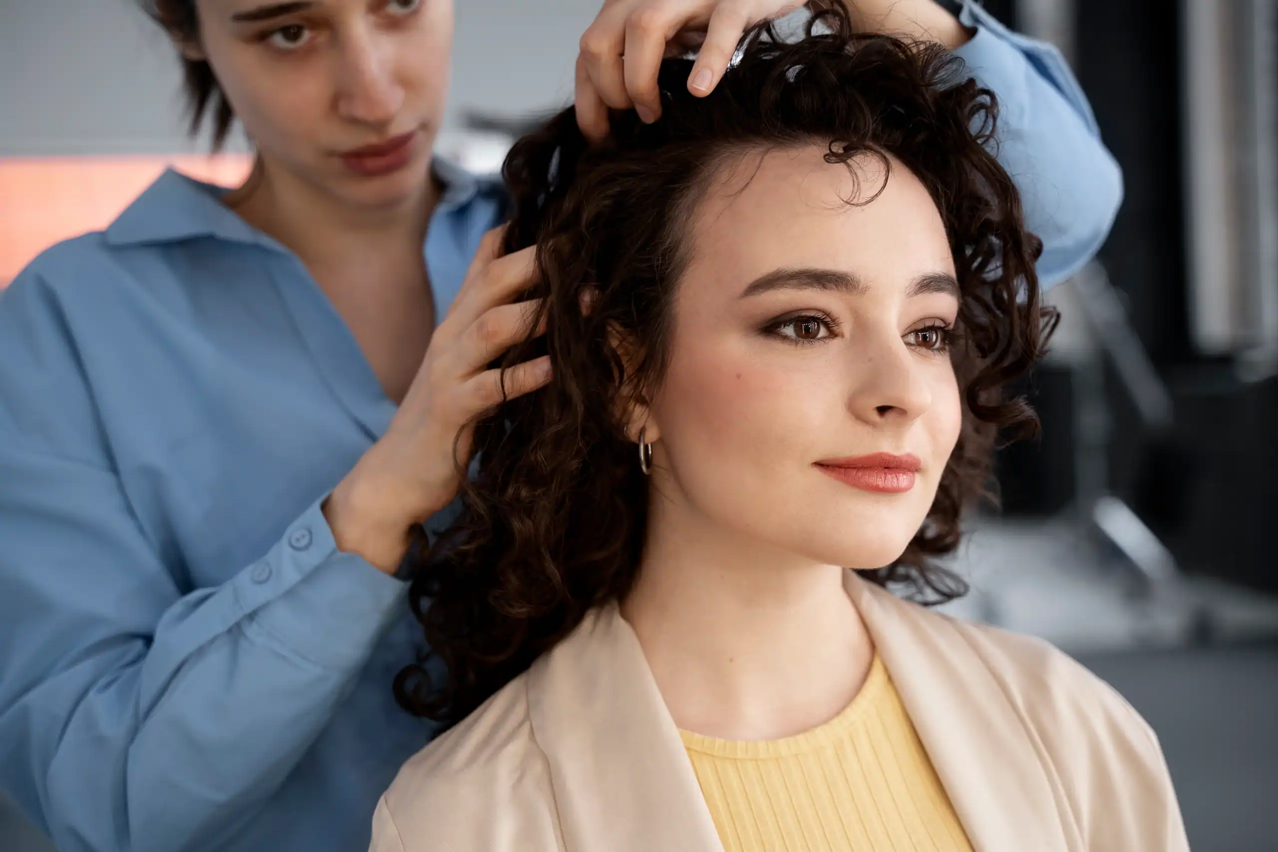 Woman getting a wig styled at Wigs by Opulence in Minnesota.