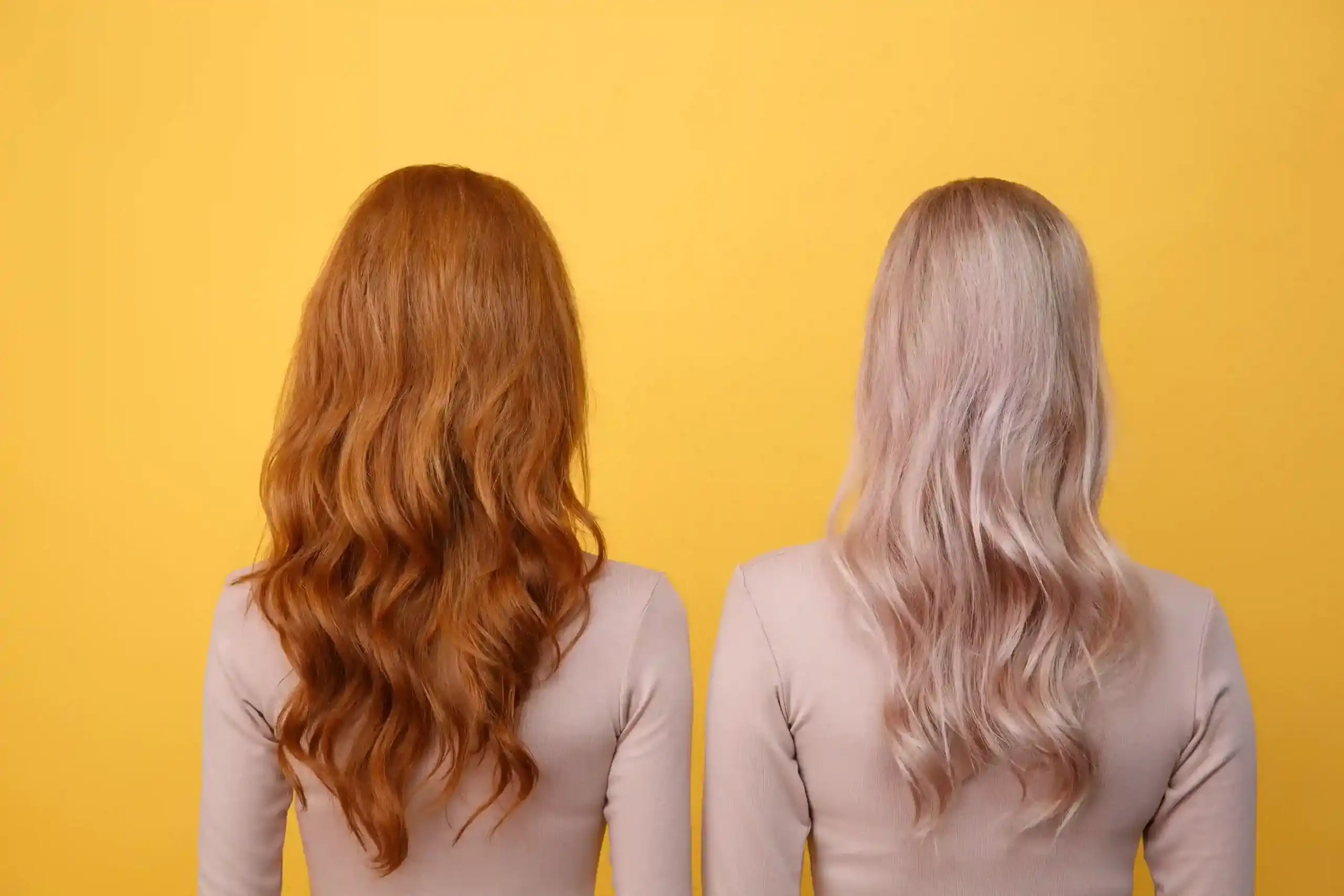 Comparison of red and blonde wigs at Wigs by Opulence in Minnesota.