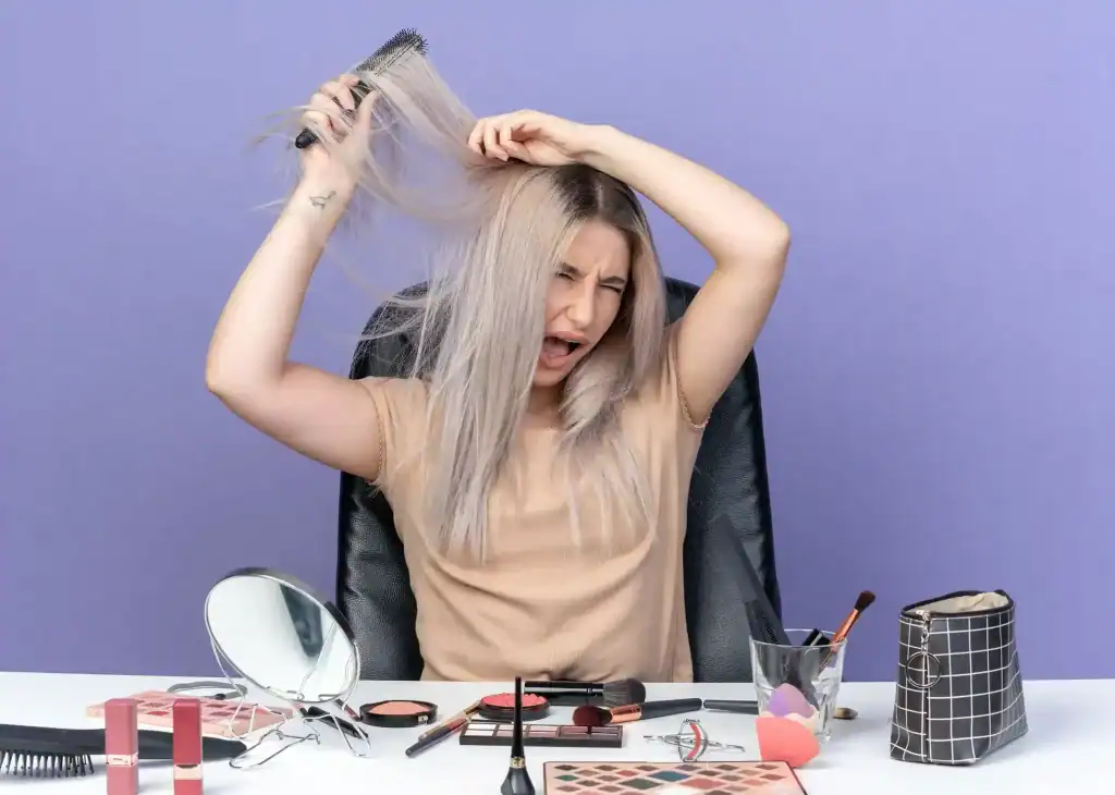 Woman struggling with frizzy wig at Minnesota salon.